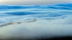 Rare 'tsunami' roll cloud hovers over beachgoers in popular destination spot