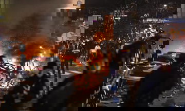 Rotterdam police open fire as Covid protest turns into ?orgy of violence?