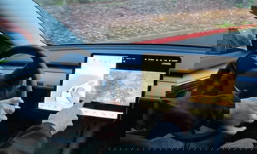 Tesla, bowing to pressure, stops allowing drivers to play video games while driving